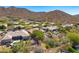 This aerial view shows the home's backyard, neighborhood and mountain views at 12366 N 129Th St, Scottsdale, AZ 85259