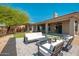 Outdoor living space with patio, lush lawn, desert landscape and mountain views at 12366 N 129Th St, Scottsdale, AZ 85259
