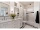 Bright bathroom featuring double sinks, stylish tile floors, and a shower-tub combination at 12366 N 129Th St, Scottsdale, AZ 85259