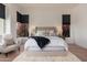 Bright bedroom featuring a cozy rug, cushioned chairs, and natural light from black-trimmed windows at 12366 N 129Th St, Scottsdale, AZ 85259