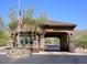 Welcoming gated community entrance features stone accents and clear signage for residents and visitors at 12366 N 129Th St, Scottsdale, AZ 85259