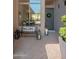Inviting entryway with welcome sign, potted plants, and ambient lanterns at 12366 N 129Th St, Scottsdale, AZ 85259