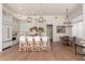 Bright kitchen with island seating, pendant lighting, stainless appliances, and tile backsplash at 12366 N 129Th St, Scottsdale, AZ 85259