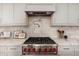 Close-up of a gourmet kitchen with a stainless steel Wolf range at 12366 N 129Th St, Scottsdale, AZ 85259