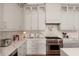 Beautiful kitchen with light gray cabinets, subway tile backsplash, and stainless steel appliances at 12366 N 129Th St, Scottsdale, AZ 85259