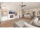 Spacious living room with fireplace, kitchen island and seating, and modern decor at 12366 N 129Th St, Scottsdale, AZ 85259