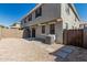 Backyard view with gravel landscaping, stone pavers, and an AC unit at 1265 S Aaron -- # 271, Mesa, AZ 85209