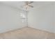 Large bedroom with neutral walls and carpet, a ceiling fan, and natural light from a large window at 1265 S Aaron -- # 271, Mesa, AZ 85209