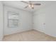 Bedroom features a window, ceiling fan, and a sliding door closet for storage and convenience at 1265 S Aaron -- # 271, Mesa, AZ 85209