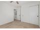 Bright bedroom featuring neutral carpet, ceiling fan, and closet space for added convenience at 1265 S Aaron -- # 271, Mesa, AZ 85209