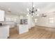 Kitchen and Living space featuring stainless steel appliances, white cabinets, and pendant lights at 1265 S Aaron -- # 271, Mesa, AZ 85209