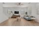 Bright living room with a ceiling fan, stylish furniture, and large windows offers a modern comfortable feel at 1265 S Aaron -- # 271, Mesa, AZ 85209
