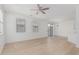 Open concept living space boasts wood floors, neutral walls, and a sliding glass door leading to the patio at 1265 S Aaron -- # 271, Mesa, AZ 85209