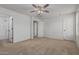 Spacious main bedroom with carpet, ceiling fan, walk in closet, and ensuite bathroom at 1265 S Aaron -- # 271, Mesa, AZ 85209