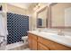 Bright bathroom featuring double sinks, modern fixtures, and a decorative shower curtain at 1453 E Elgin Pl, Chandler, AZ 85225