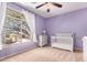 Bedroom bedroom with lavender walls, grey furniture, and natural light at 1453 E Elgin Pl, Chandler, AZ 85225