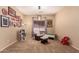 Bedroom with soft carpet, playful decor and a comfortable chair at 1453 E Elgin Pl, Chandler, AZ 85225