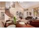 Spacious dining room area with a staircase, seating, and a view into the living room at 1453 E Elgin Pl, Chandler, AZ 85225