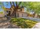 Charming two-story home with mature trees, well-kept lawn, and convenient three-car garage at 1453 E Elgin Pl, Chandler, AZ 85225