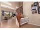 Bright foyer with tile flooring, staircase, and living room in the background at 1453 E Elgin Pl, Chandler, AZ 85225