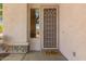 Close-up of a welcoming front entrance with a security screen door and decorative details at 1453 E Elgin Pl, Chandler, AZ 85225