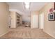 Hallway with carpet, light beige walls and some decor pictures along the wall at 1453 E Elgin Pl, Chandler, AZ 85225