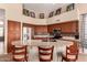 Kitchen area with updated stainless steel appliances, stylish countertops, and tile backsplash at 1453 E Elgin Pl, Chandler, AZ 85225