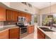 Modern kitchen with stainless steel appliances, granite countertops, and tile backsplash at 1453 E Elgin Pl, Chandler, AZ 85225