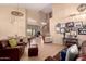 Open-concept living space with dining area, staircase, and comfortable seating arrangement at 1453 E Elgin Pl, Chandler, AZ 85225