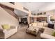 Bright living room featuring a staircase, comfortable seating, and an open floor plan at 1453 E Elgin Pl, Chandler, AZ 85225