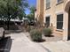 Side view of an attractive home with desert landscaping, a built-in bench, and privacy wall at 14575 W Mountain View Blvd # 711, Surprise, AZ 85374