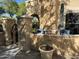Cozy patio with seating, potted plants, and an umbrella for relaxing outdoors at 14575 W Mountain View Blvd # 711, Surprise, AZ 85374
