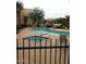 This pool is complete with a hot tub, several lounge chairs, and an apartment building at 14575 W Mountain View Blvd # 711, Surprise, AZ 85374