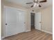 Bedroom featuring wood-look floors, closet, and a doorway at 1535 E Kenwood St, Mesa, AZ 85203