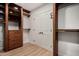 Walk-in closet with custom wooden shelving, drawers, and a view of the closet door at 1535 E Kenwood St, Mesa, AZ 85203