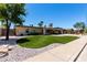 Charming single story home with landscaped front yard, desert landscaping, and brick driveway at 1535 E Kenwood St, Mesa, AZ 85203