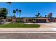 Charming single story home with landscaped front yard, desert landscaping, and brick driveway at 1535 E Kenwood St, Mesa, AZ 85203