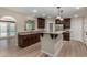 Modern kitchen boasts granite countertops, stainless steel appliances, and a breakfast bar at 1535 E Kenwood St, Mesa, AZ 85203