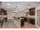 Open kitchen featuring granite counters, a breakfast bar, and stainless-steel appliances at 1535 E Kenwood St, Mesa, AZ 85203