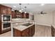 Well-equipped kitchen with granite countertops and stainless steel appliances provides a comfortable cooking space at 1535 E Kenwood St, Mesa, AZ 85203