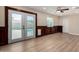 Bright room with doors leading to pool area, wood paneling, and neutral paint color at 1535 E Kenwood St, Mesa, AZ 85203