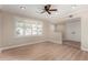 Bright living room featuring recessed lighting, modern flooring and window with shutters at 1535 E Kenwood St, Mesa, AZ 85203
