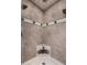 Close-up of a custom-tiled shower with mosaic accents and dual shower heads at 1535 E Kenwood St, Mesa, AZ 85203
