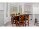 Dining area features a wooden table with chairs, stylish decor, and natural lighting at 15753 W Christy Dr, Surprise, AZ 85379