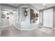 Open foyer with tile floors, neutral paint, and elegant artwork, creating a welcoming entrance at 15753 W Christy Dr, Surprise, AZ 85379