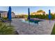 Backyard with a pool, lush landscaping, and plenty of space for outdoor seating and activities at 15753 W Christy Dr, Surprise, AZ 85379