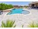 Inviting pool features a waterfall, shallow tanning area, and plenty of room to relax poolside at 15753 W Christy Dr, Surprise, AZ 85379