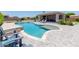 Beautiful backyard oasis with a sparkling pool and an outdoor kitchen and entertainment area at 15753 W Christy Dr, Surprise, AZ 85379