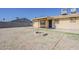 A low maintenance backyard features gravel landscaping, privacy fence and a covered patio at 15845 N 60Th Dr, Glendale, AZ 85306