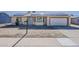 Charming single-story home with a two car garage and solar panels on the roof at 15845 N 60Th Dr, Glendale, AZ 85306